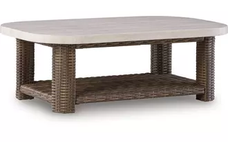 Ashley dolan creek rectangular cocktail table in beige/brown
