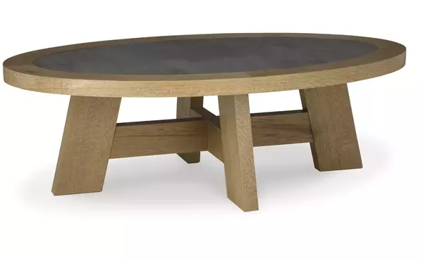brinstead light brown oval cocktail table by ashley