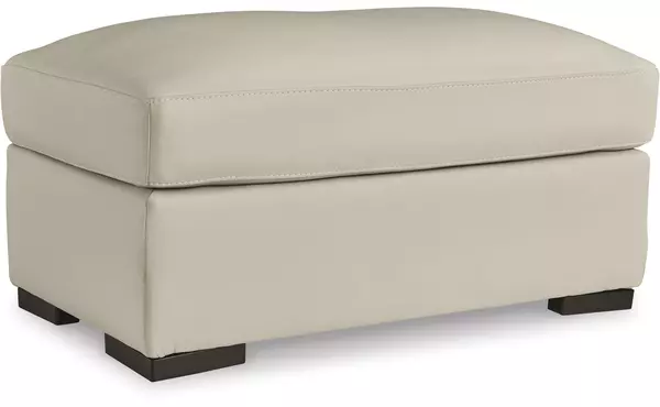 treasure trove almond ottoman by ashley